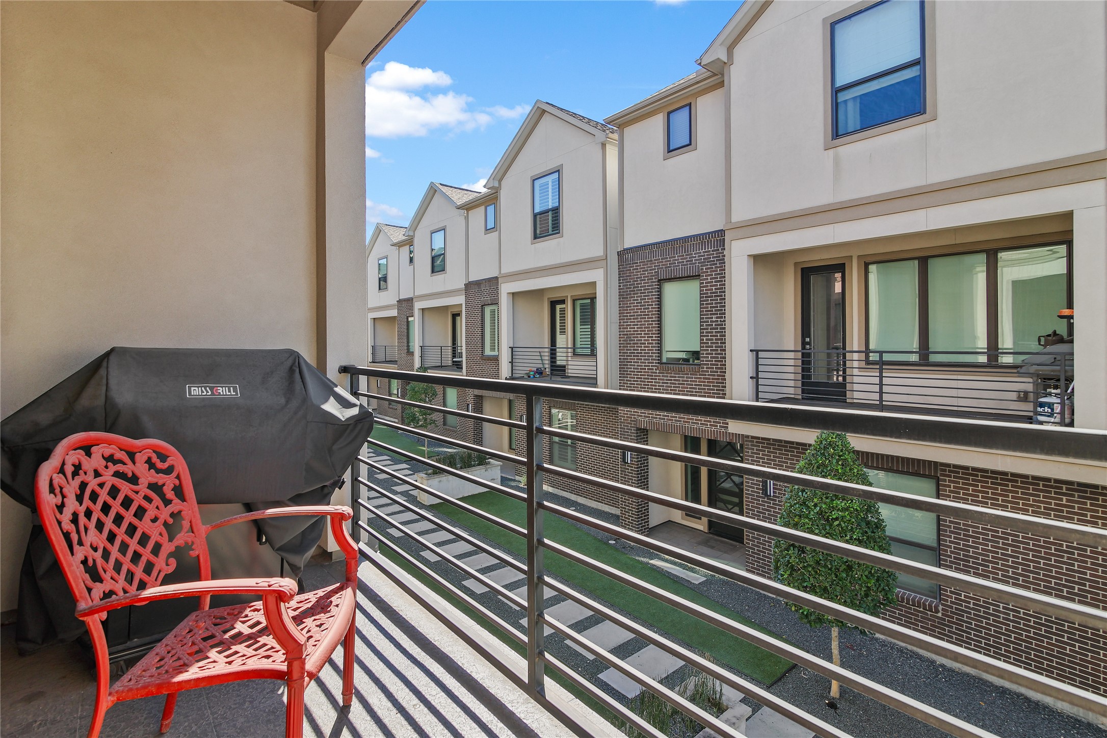 4231 Allen Street Houston, TX 77007 - Photo 15 of 31 Enjoy your own private balcony overlooking the modern styled courtyard! The grill and two beautiful wrought iron chairs are yours if you want them!