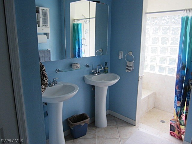 12931 Shawnee Road Fort Myers, FL 33913 - Photo 11 of 19 a bathroom with a sink toilet and a mirror