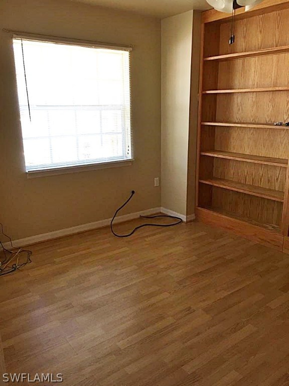 12931 Shawnee Road Fort Myers, FL 33913 - Photo 13 of 19 a view of a room with wooden floor and windows
