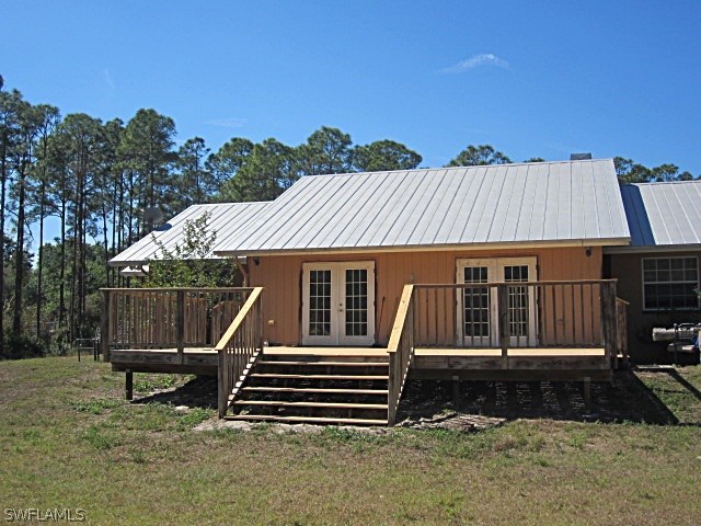 12931 Shawnee Road Fort Myers, FL 33913 - Photo 18 of 19 a view of a house with a yard