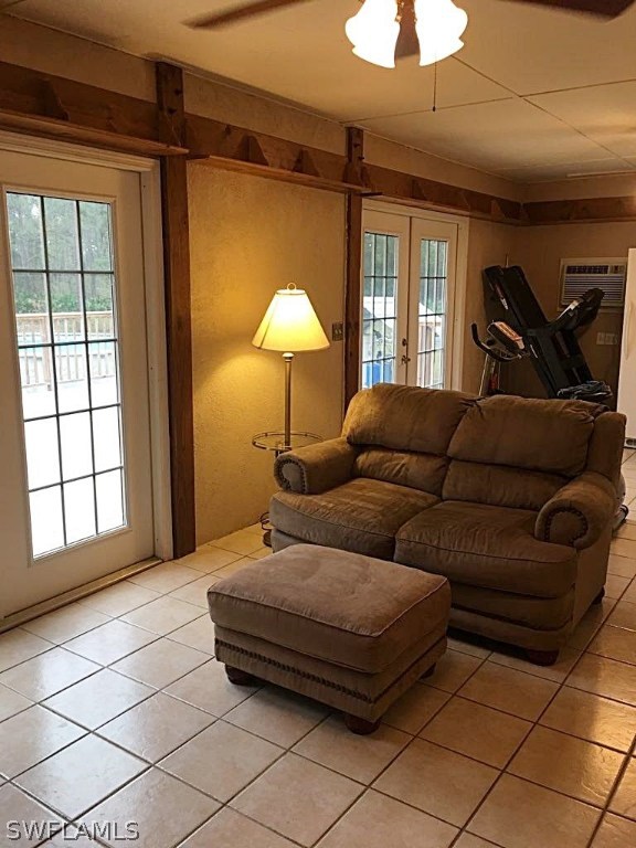 12931 Shawnee Road Fort Myers, FL 33913 - Photo 6 of 19 a living room with a couch and a chandelier