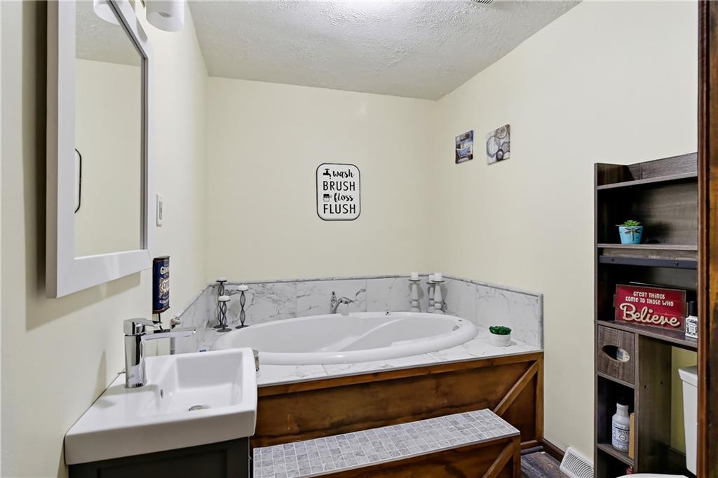 2516 Clayton Road Beaver Falls, PA 15010 - Photo 14 of 24 Guest Bathroom with Natural ceramic tile and large soaker tub