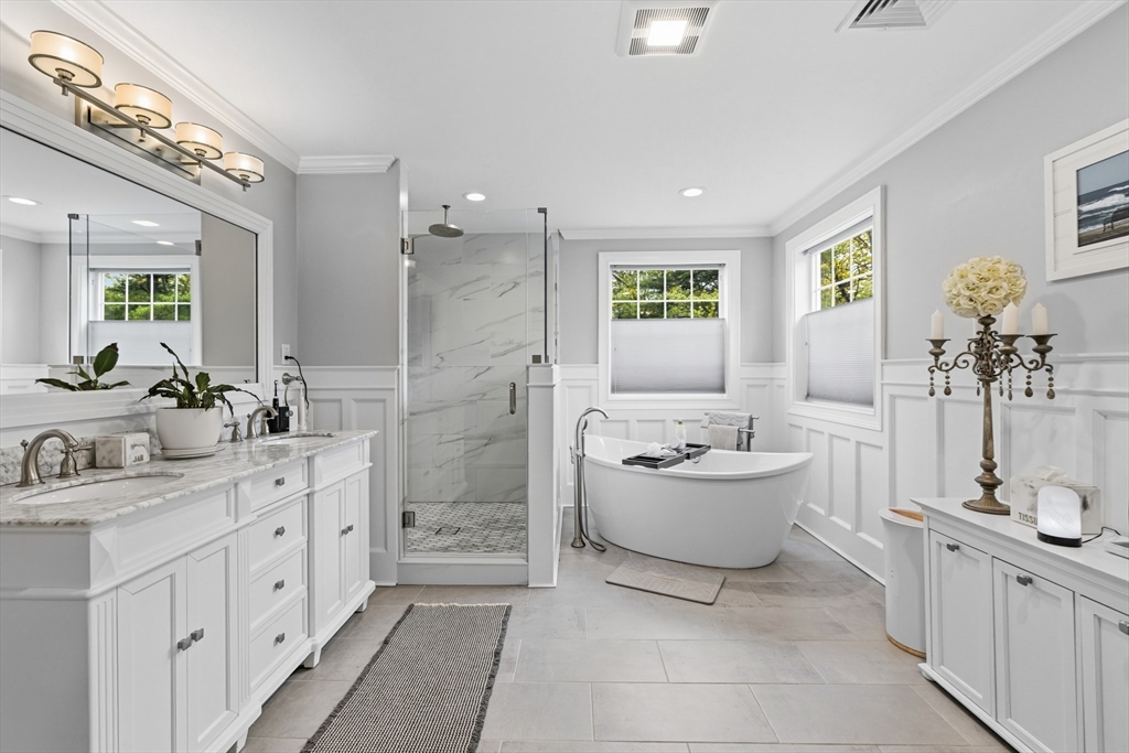 35 High Street Freetown, MA 02702 - Photo 35 of 40 a spacious bathroom with a double vanity sink mirror and bathtub