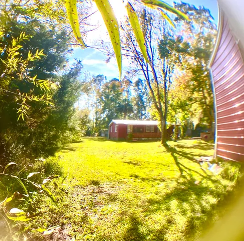 a view of swimming pool with yard