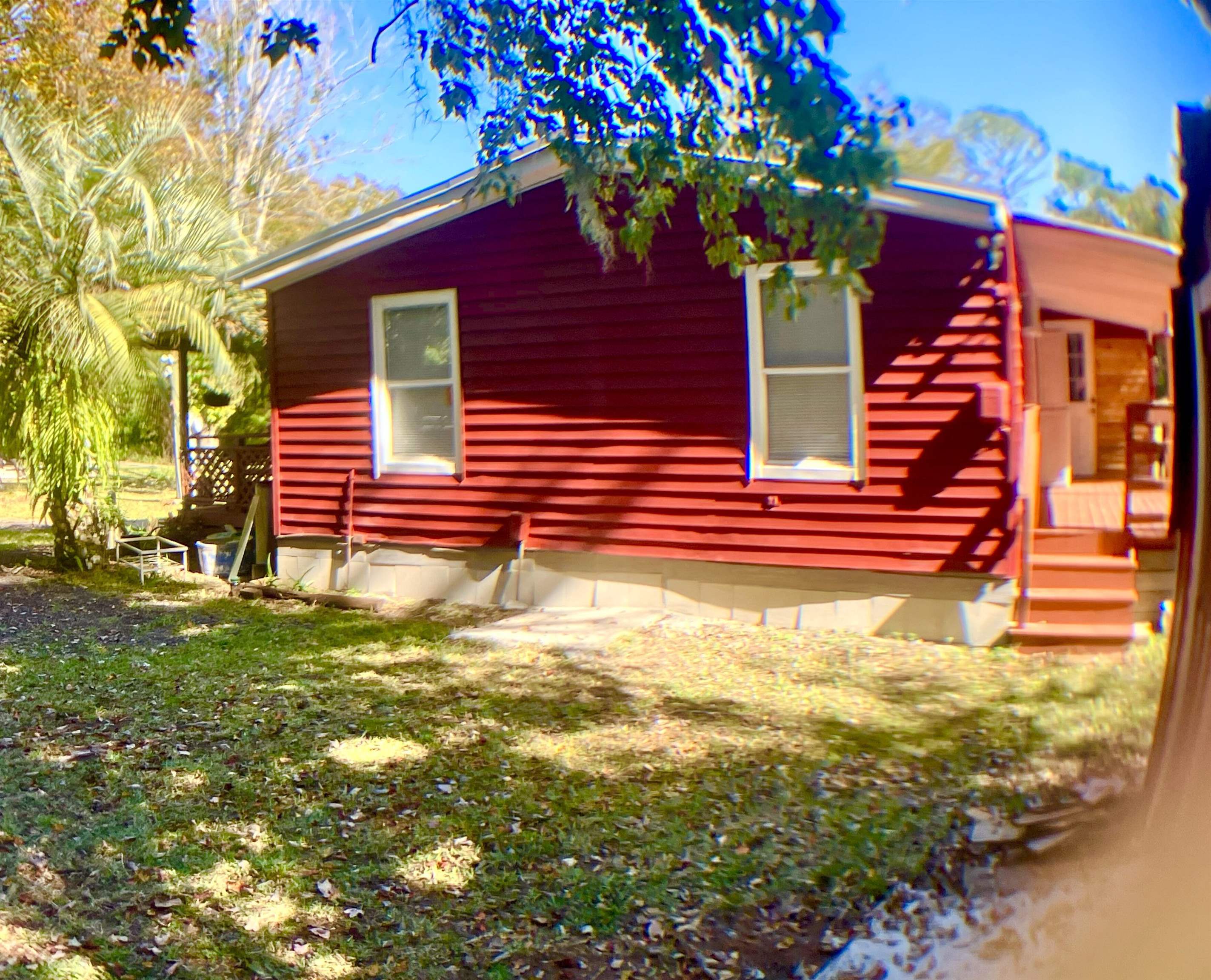 1611 Brian Way St. Augustine, FL 32084 - Photo 12 of 23 a front view of a house with a yard