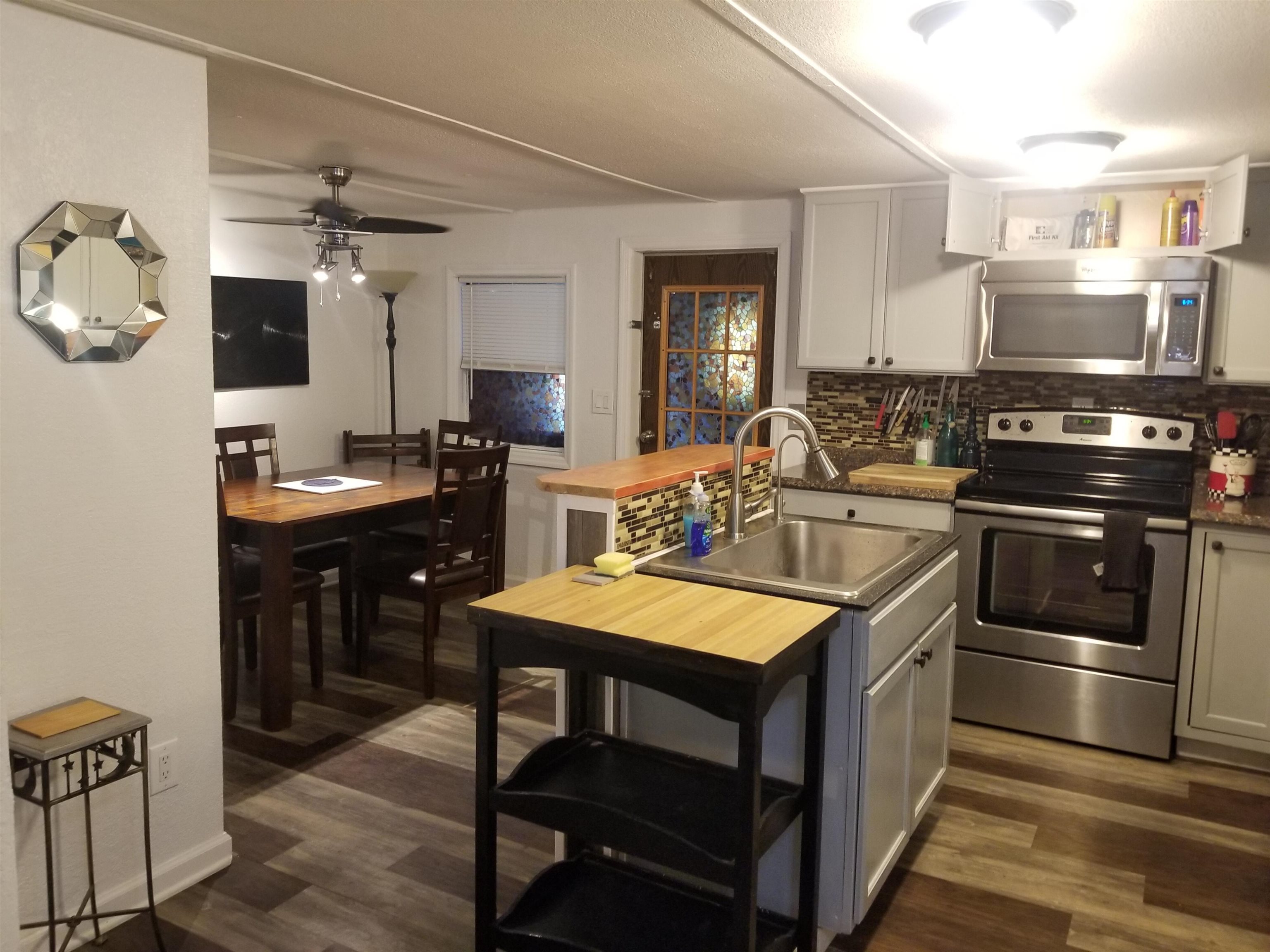 1611 Brian Way St. Augustine, FL 32084 - Photo 6 of 23 a kitchen with stainless steel appliances granite countertop a stove a sink and a refrigerator