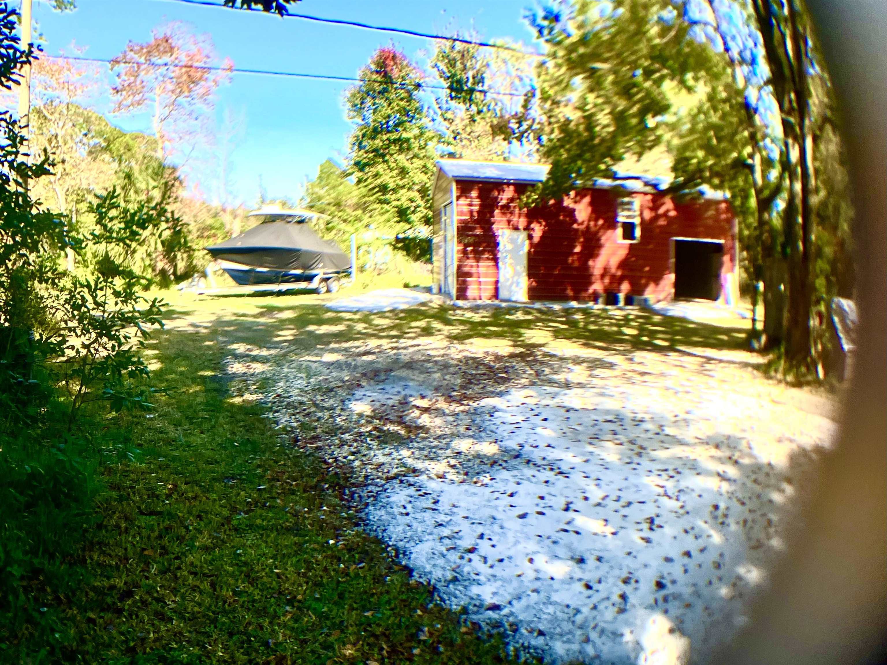 1611 Brian Way St. Augustine, FL 32084 - Photo 9 of 23 a front view of a house with a yard