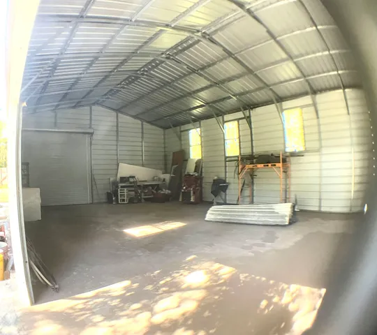 a view of a hall with wooden floor