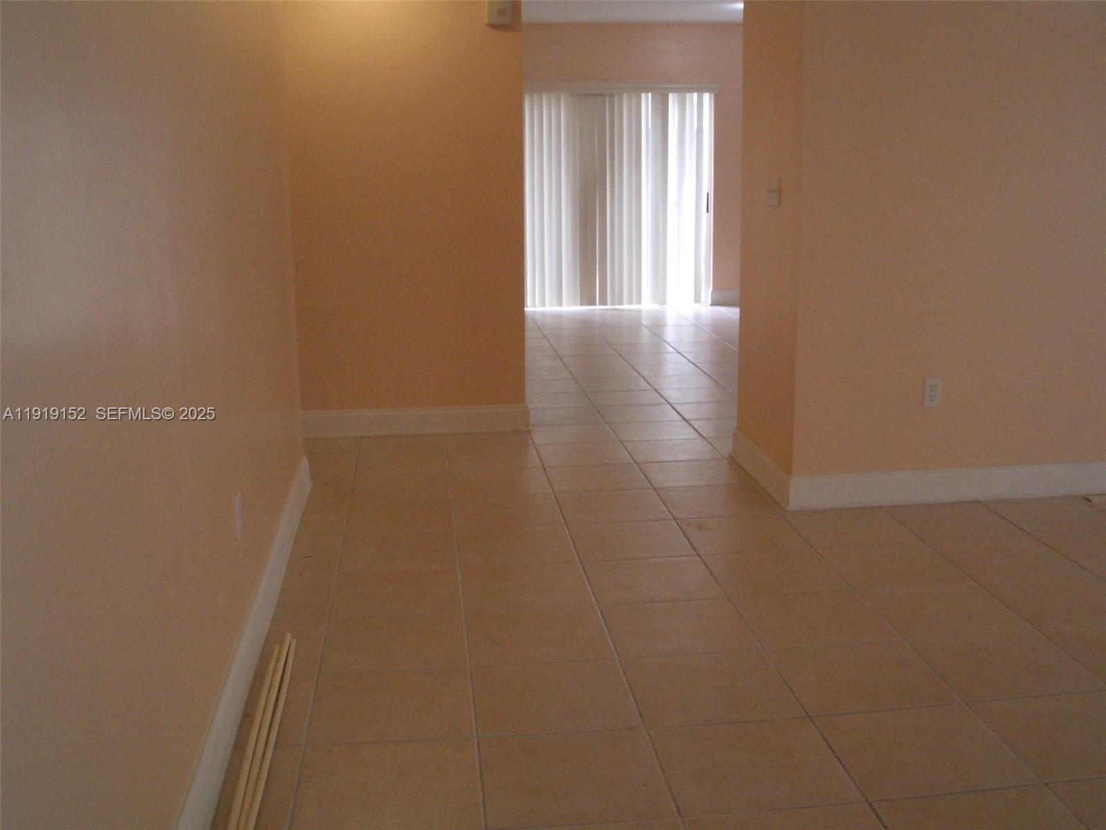 12838 Southwest 256th Terrace Homestead, FL 33032 - Photo 2 of 5 a view of a hallway