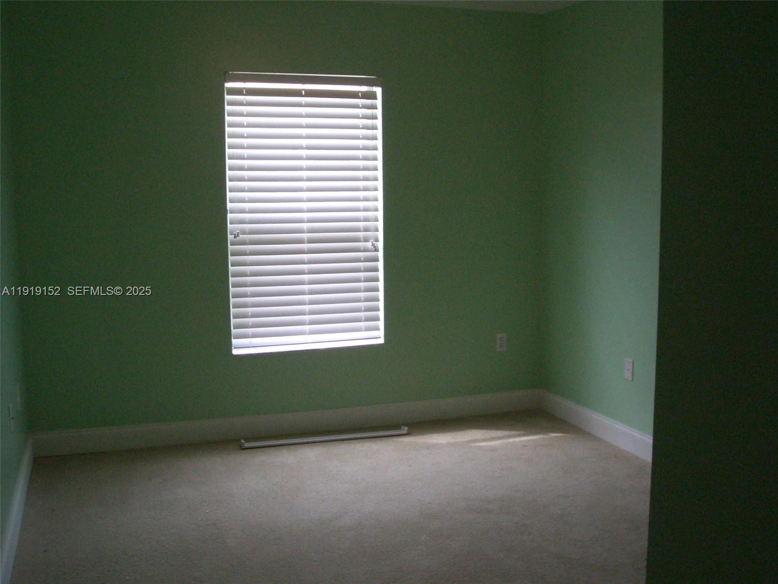 12838 Southwest 256th Terrace Homestead, FL 33032 - Photo 5 of 5 a view of a room that has a window in it