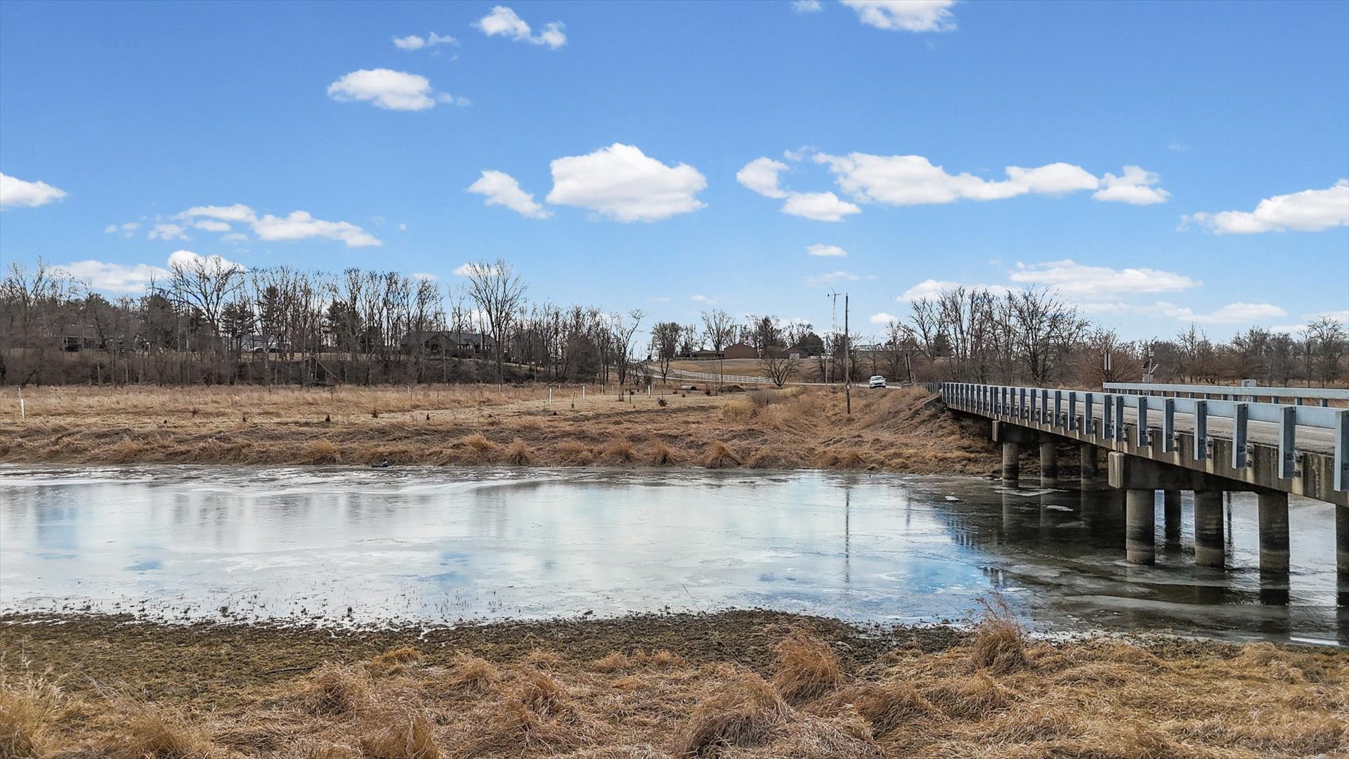 N 2545 E Road Farmer City, IL 61842 - Photo 5 of 47 a view of a water pond with lots of trees in the background