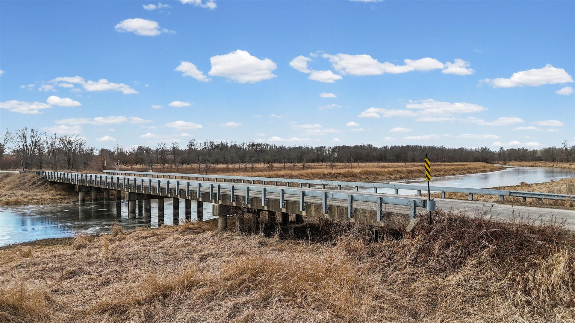 N 2545 E Road Farmer City, IL 61842 - Photo 6 of 47 a view of a lake with table and chairs