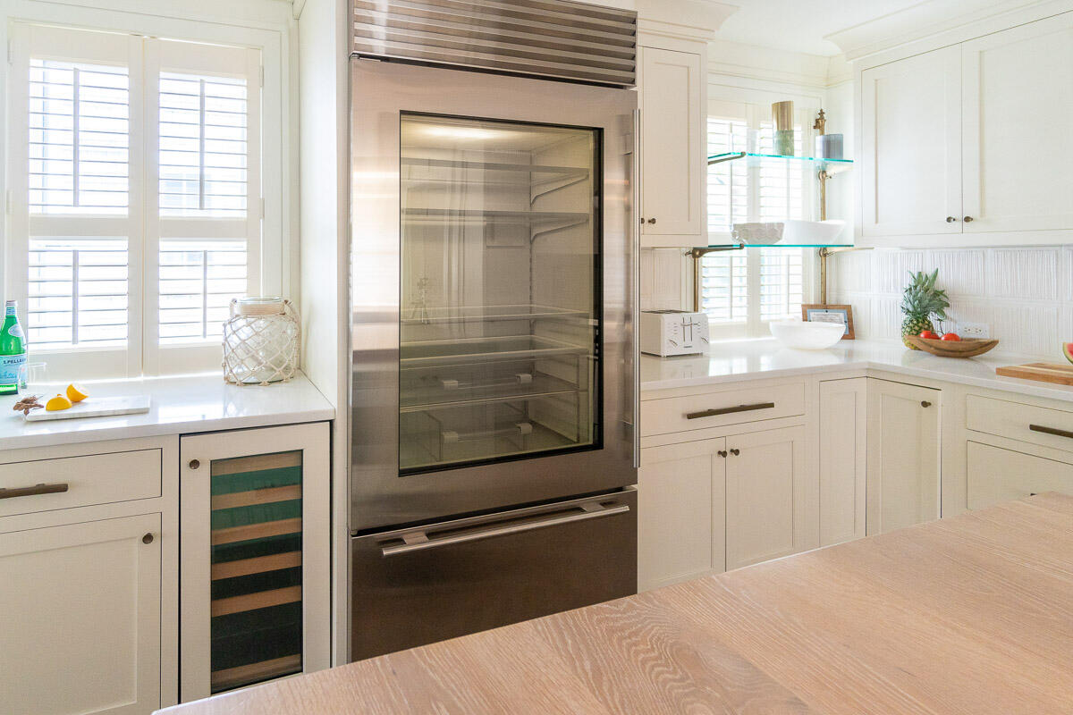 42.5 Union Street Nantucket, MA 02554 - Photo 13 of 33 a kitchen with a refrigerator and white cabinets