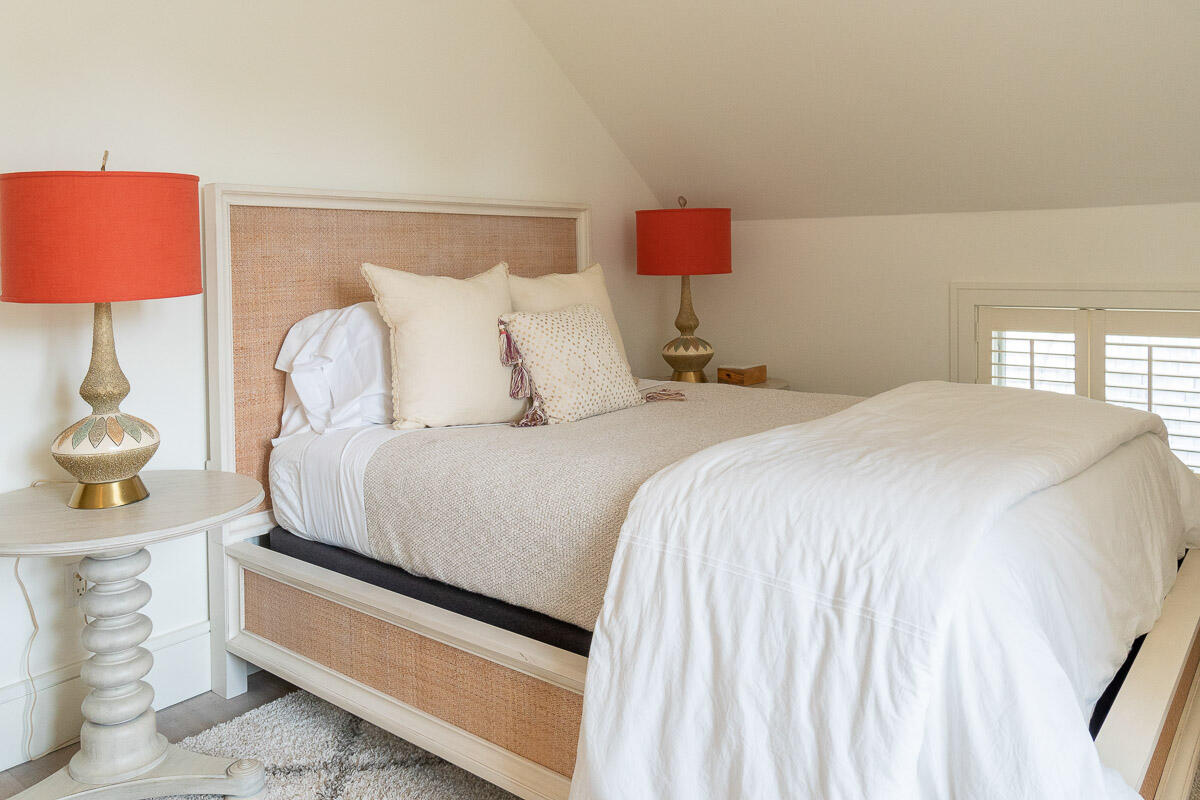 42.5 Union Street Nantucket, MA 02554 - Photo 23 of 33 a spacious bedroom with a bed and a lamp