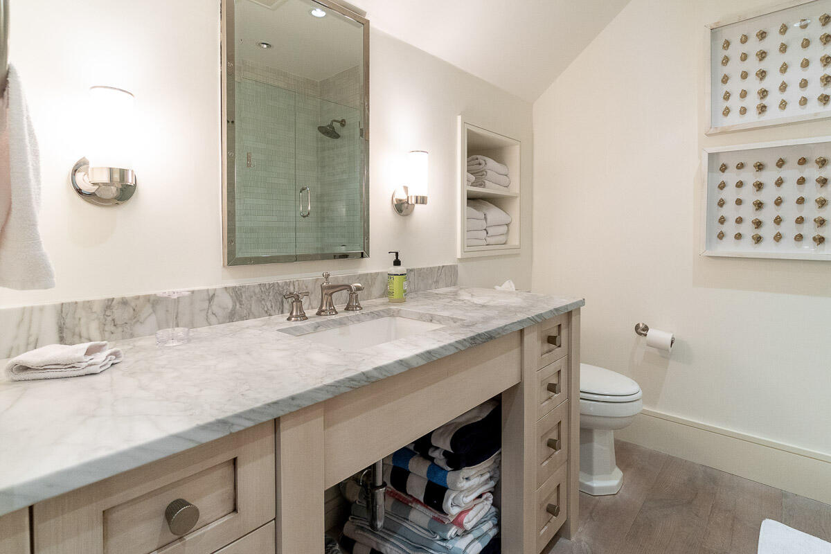 42.5 Union Street Nantucket, MA 02554 - Photo 25 of 33 a bathroom with a granite countertop sink a toilet and a mirror