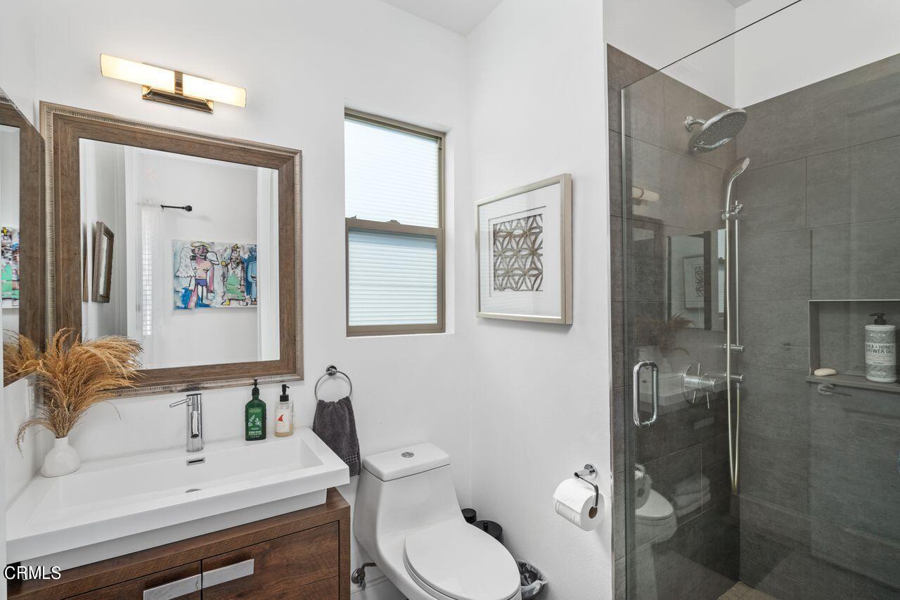 3875 Cartwright Street Pasadena, CA 91107 - Photo 13 of 25 a bathroom with a sink toilet and shower