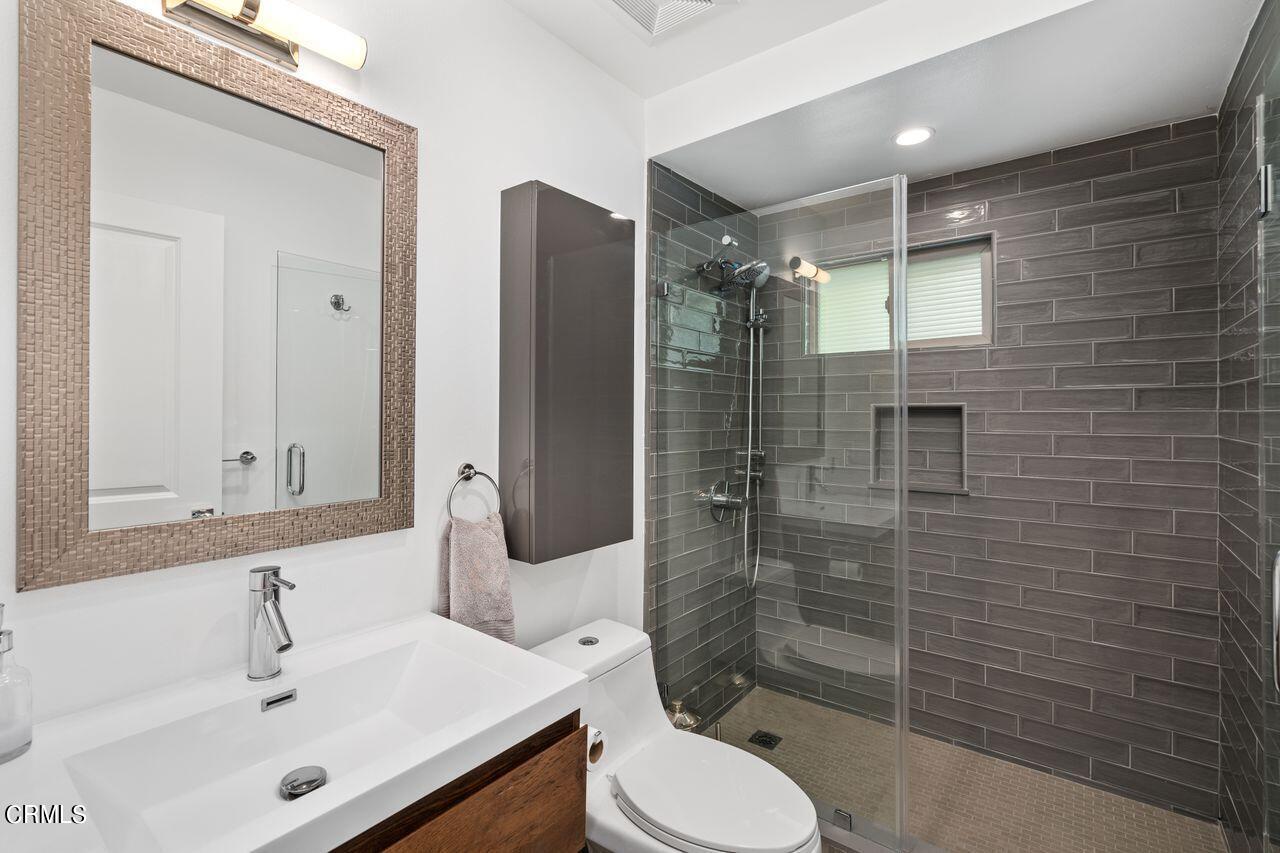 3875 Cartwright Street Pasadena, CA 91107 - Photo 17 of 25 a bathroom with a sink toilet and shower