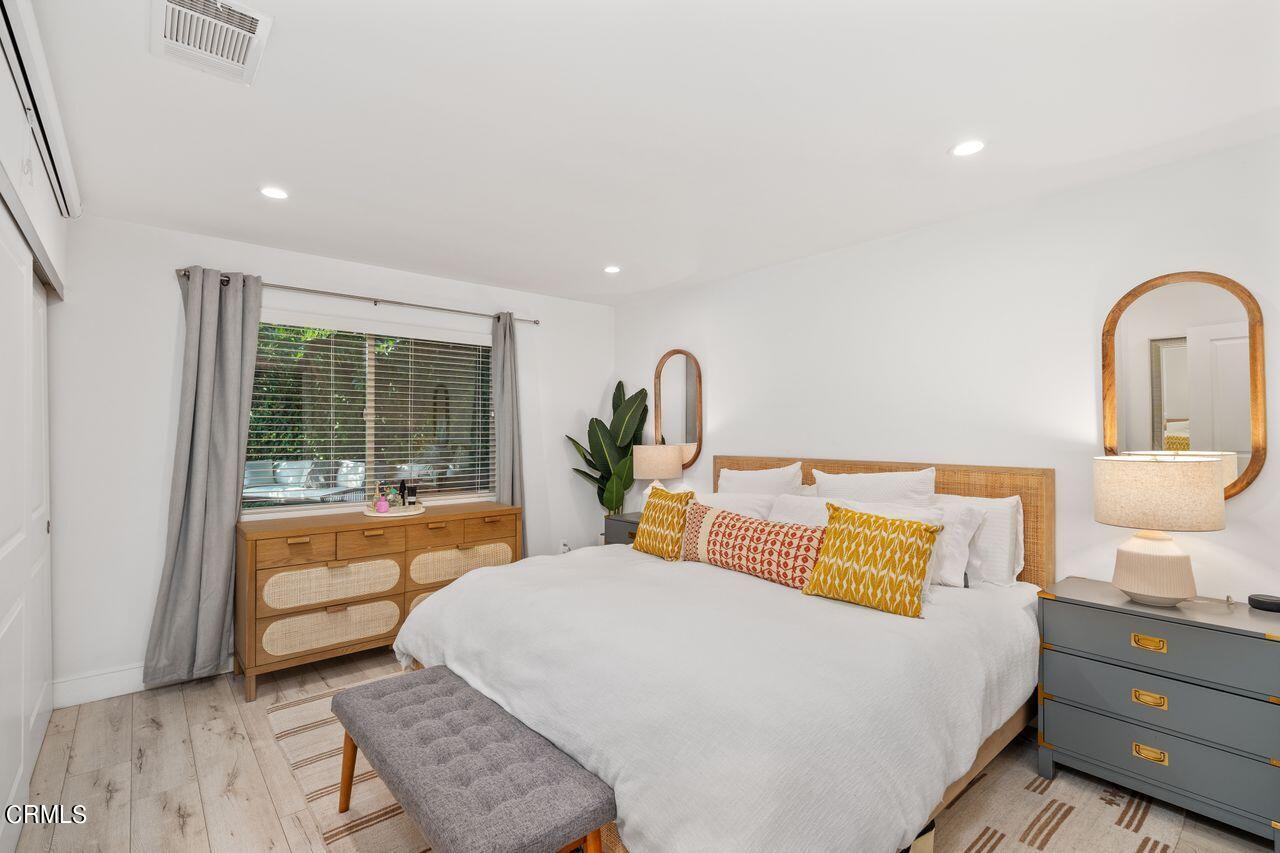 3875 Cartwright Street Pasadena, CA 91107 - Photo 18 of 25 a bedroom with a bed and wooden floor