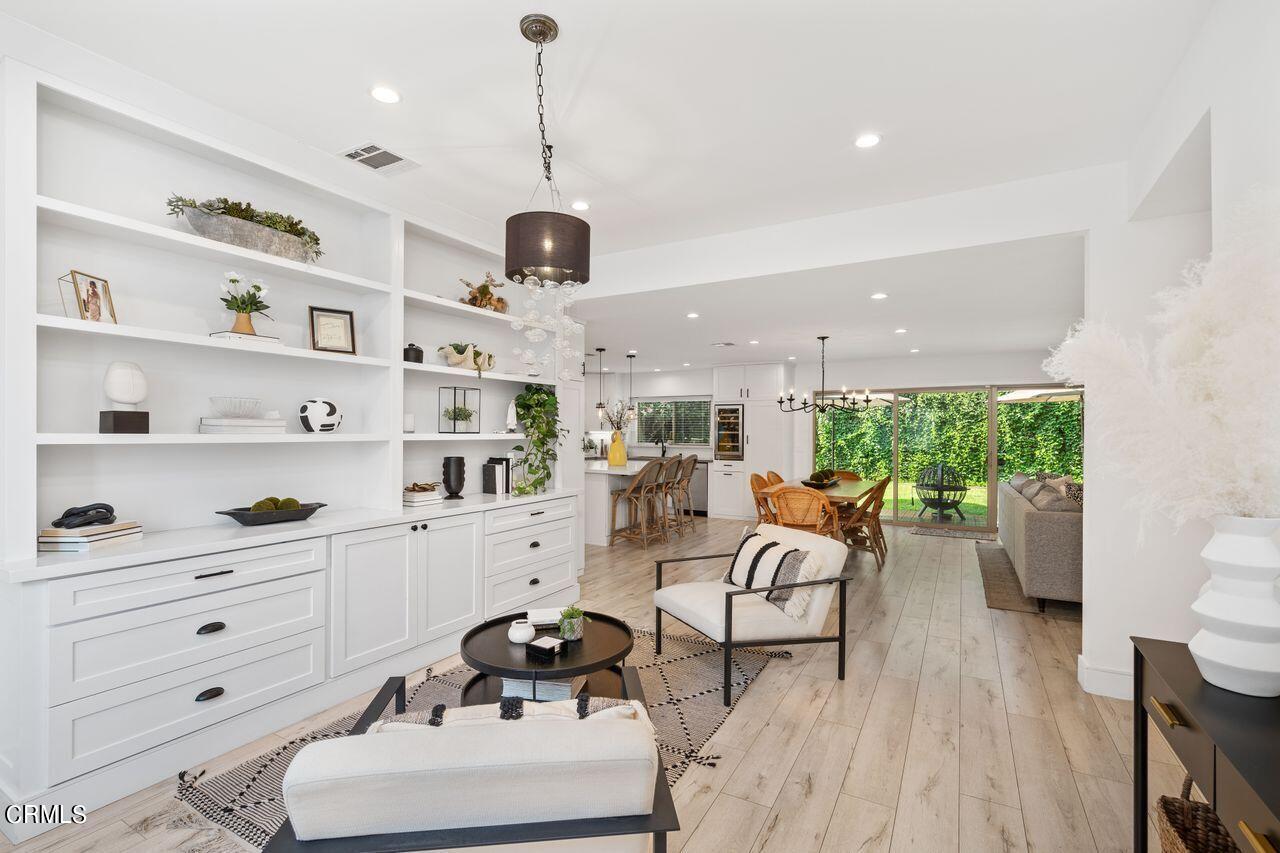 3875 Cartwright Street Pasadena, CA 91107 - Photo 4 of 25 a living room with furniture a rug and a flat screen tv