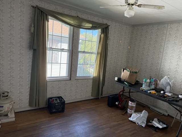 a room with furniture and wooden floor