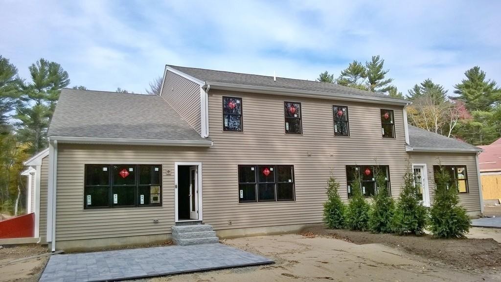 16 Kevin's Way, Unit 7 Scituate, MA 02066 - Photo 16 of 19 a front view of a house with a yard