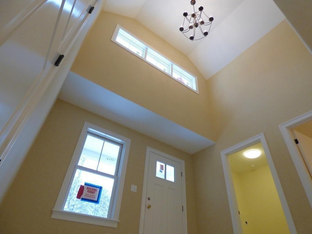 16 Kevin's Way, Unit 7 Scituate, MA 02066 - Photo 2 of 19 a view of an entryway with chandelier