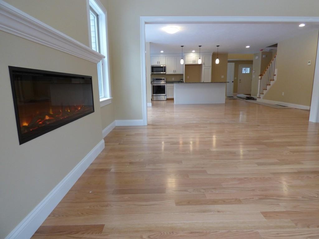 16 Kevin's Way, Unit 7 Scituate, MA 02066 - Photo 7 of 19 a view of a living room with a fireplace