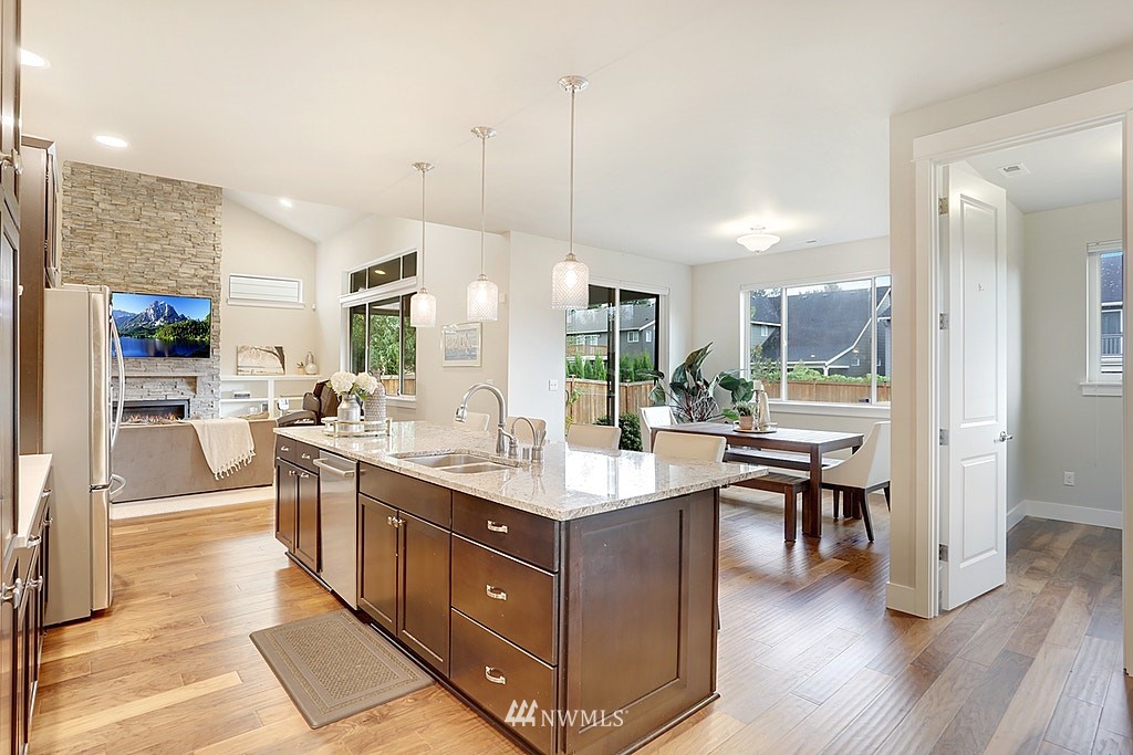 5213 Northeast 2nd Place Renton, WA 98059 - Photo 11 of 25 a kitchen with counter top space and wooden floor