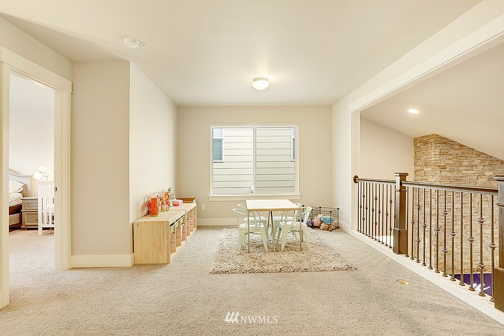 5213 Northeast 2nd Place Renton, WA 98059 - Photo 16 of 25 a view of a livingroom with furniture and windows