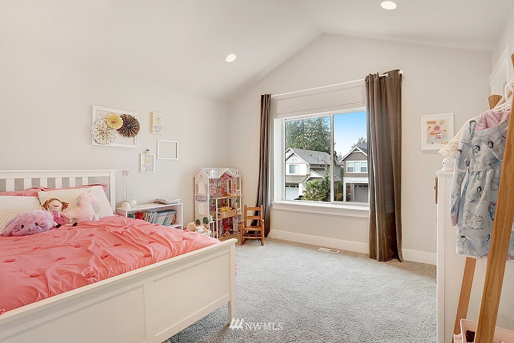 5213 Northeast 2nd Place Renton, WA 98059 - Photo 19 of 25 a bedroom with a bed and a large window