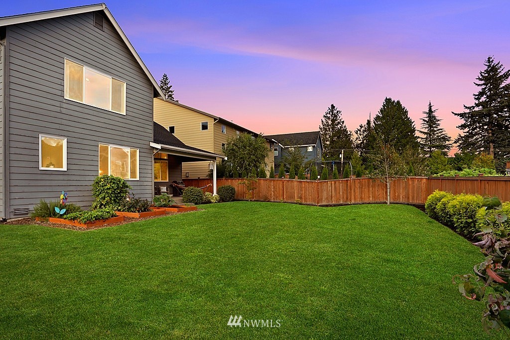 5213 Northeast 2nd Place Renton, WA 98059 - Photo 23 of 25 a view of a backyard with plants and a garden