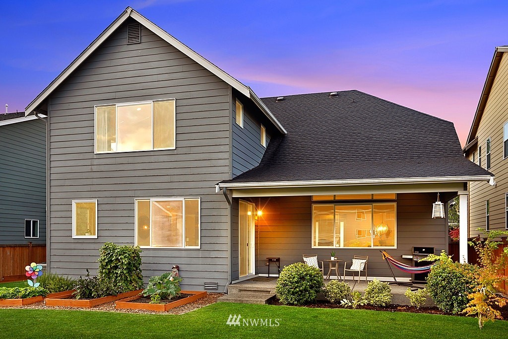 5213 Northeast 2nd Place Renton, WA 98059 - Photo 25 of 25 a front view of a house with a yard
