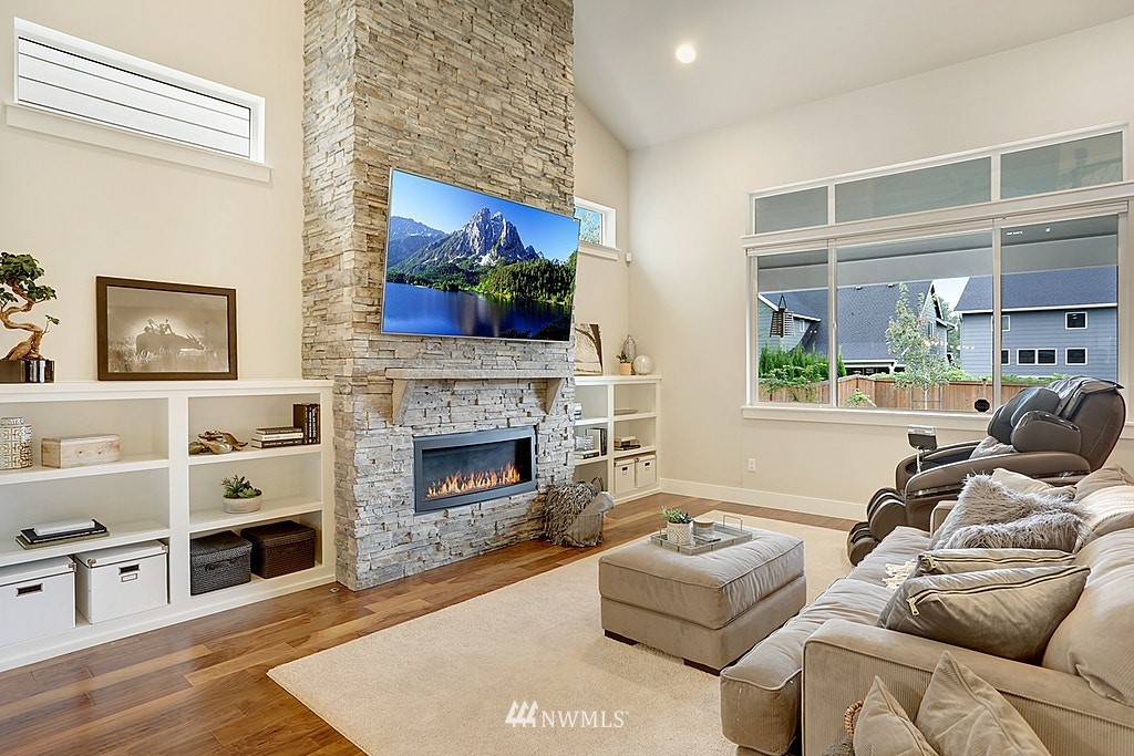 5213 Northeast 2nd Place Renton, WA 98059 - Photo 6 of 25 a living room with furniture and a fireplace