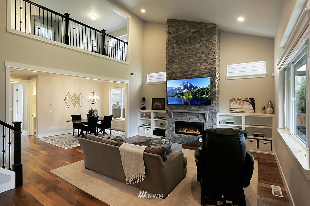 5213 Northeast 2nd Place Renton, WA 98059 - Photo 7 of 25 a living room with fireplace furniture and a fireplace
