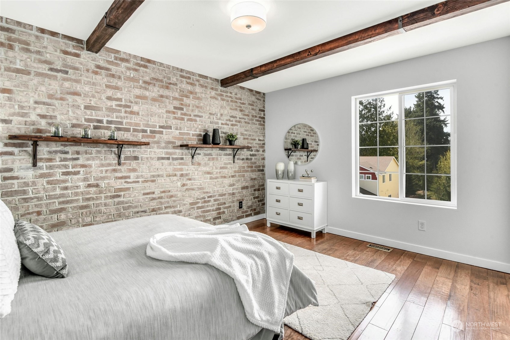 22313 35th Drive Southeast Bothell, WA 98021 - Photo 14 of 26 a bedroom with a bed and a wooden floor