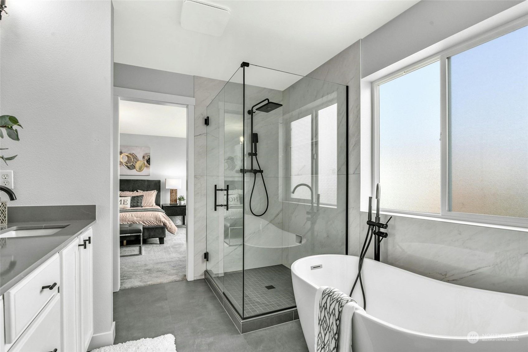 22313 35th Drive Southeast Bothell, WA 98021 - Photo 20 of 26 a bathroom with a tub a sink and a mirror