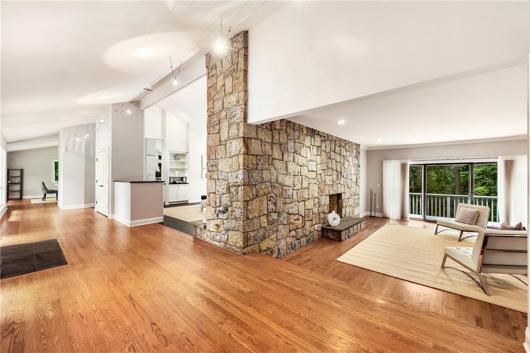 54 Mountain Peak Road Chappaqua, NY 10514 - Photo 1 of 1 a living room with furniture large window and a table