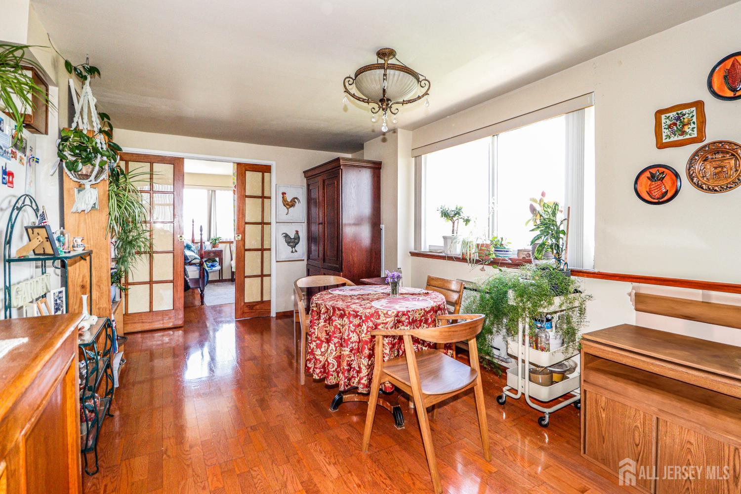 40 Fayette Street, Unit 57 Perth Amboy, NJ 08861 - Photo 5 of 33 a view of a dining room with furniture window and wooden floor