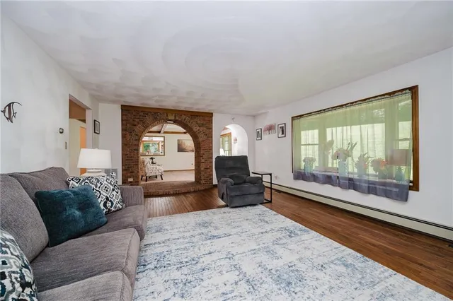 a living room with a couch and a large window