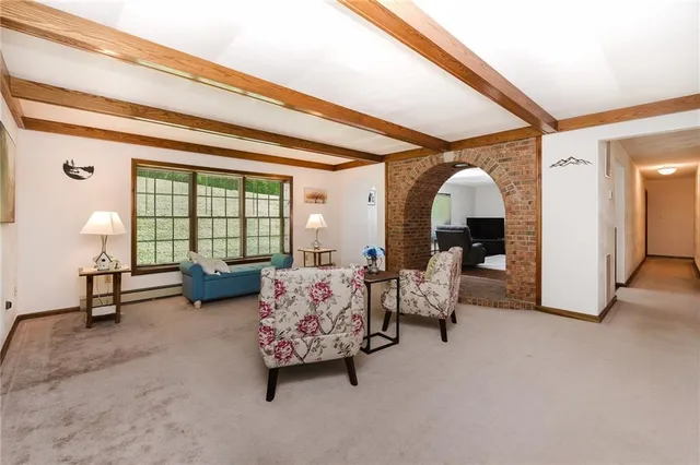 a living room with furniture and a table