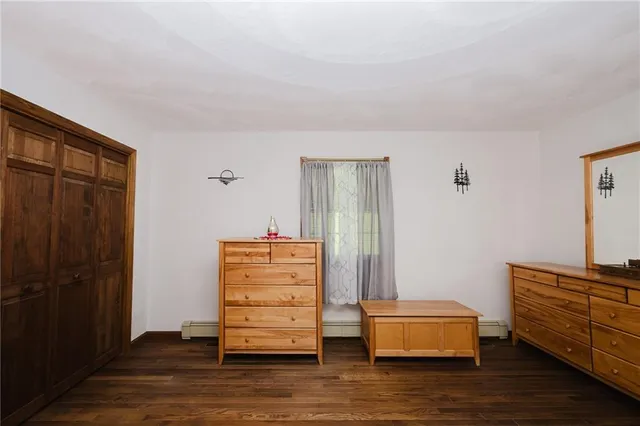 a room with furniture and wooden floor