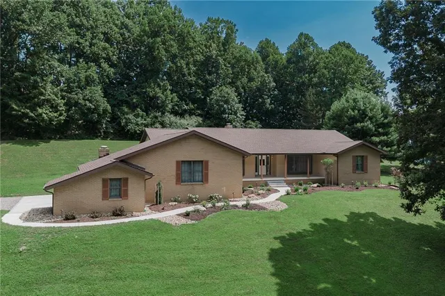 a front view of a house with garden