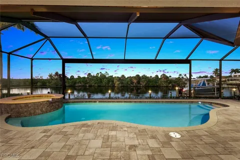 a view of a swimming pool and a yard