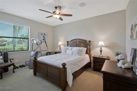 a bedroom with bed and window