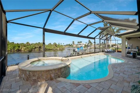 a view of a swimming pool with a patio