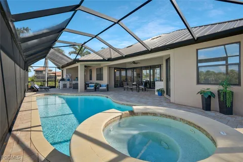 a swimming pool with outdoor seating