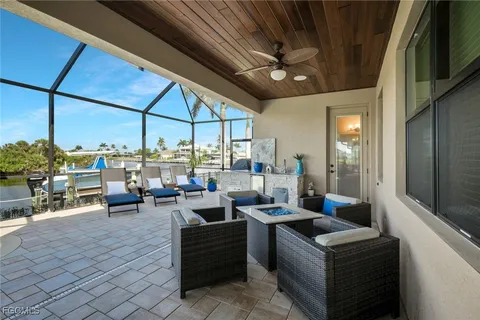 a view of a dinning table and chairs in the balcony