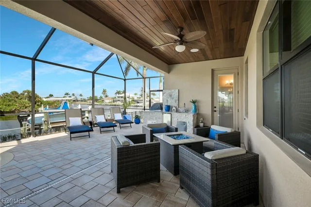 a view of a dinning table and chairs in the balcony