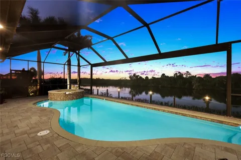 a view of a swimming pool with a patio
