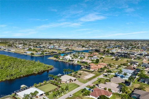 an aerial view of a city with ocean view